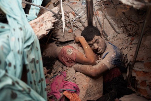 April 25, 2013. Two victims amid the rubble of a garment factory building collapse in Savar, near Dhaka, Bangladesh. Read more: http://lightbox.time.com/2013/05/08/a-final-embrace-the-most-haunting-photograph-from-bangladesh/#ixzz2SlWRG3gY